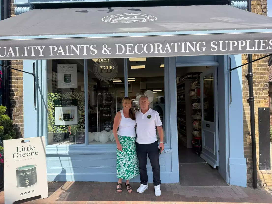 Sarah and Matt outside the Ashley & Lewis shopfront in Godalming